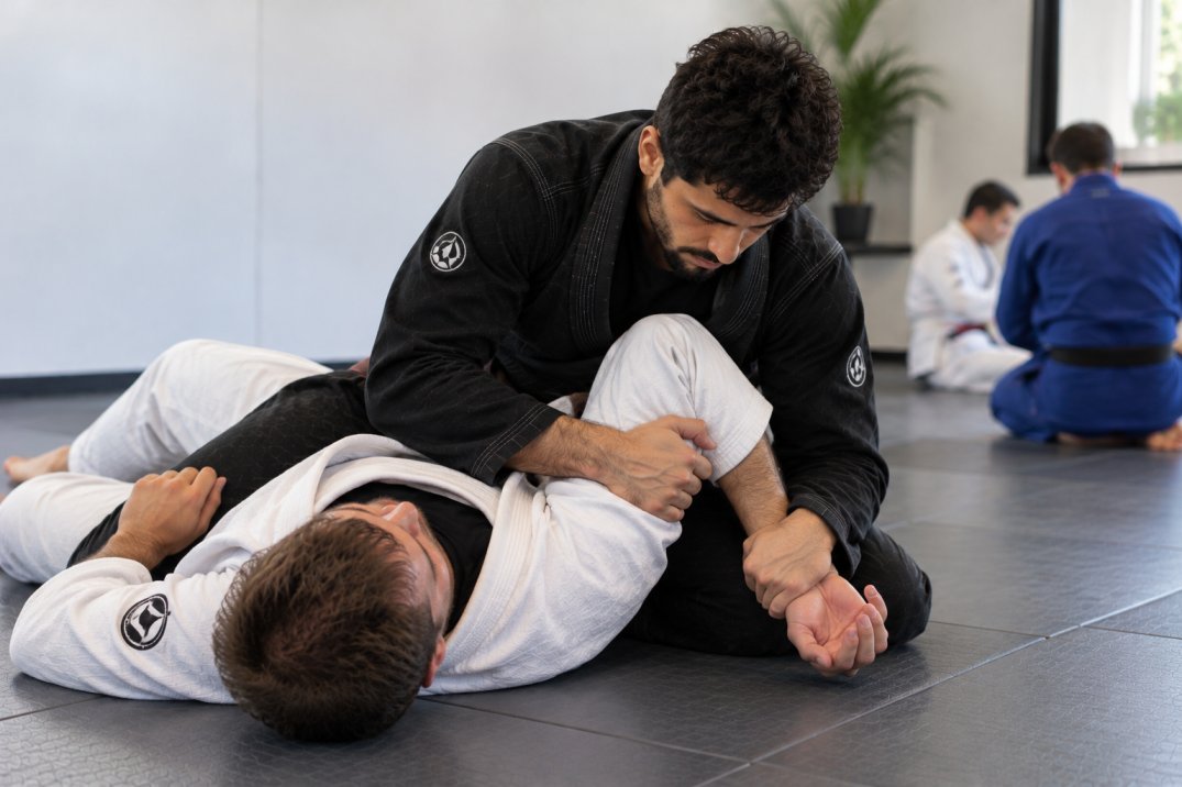 BJJ Americana figure-four grip and arm control concept on the mat